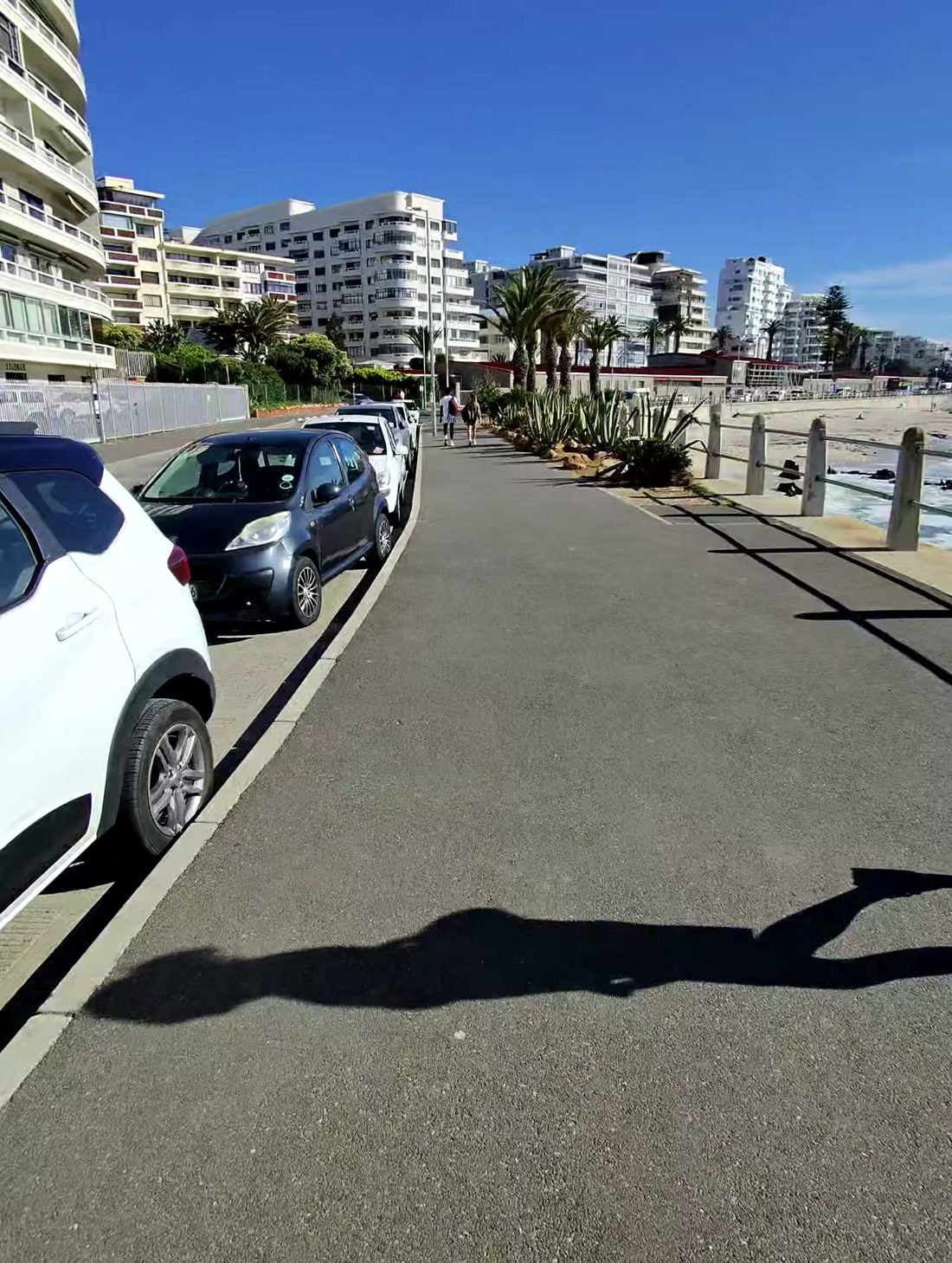 Seaside promenade with parked cars